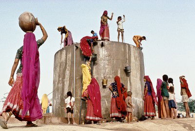 collecting water, Rajasthan by Christopher Pillitz